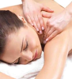 CIBTAC Massage Diploma in Swedish Body Massage. A practitioner kneading customer's shoulder