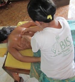 Bali BISA trainer showing muscles on the back to students