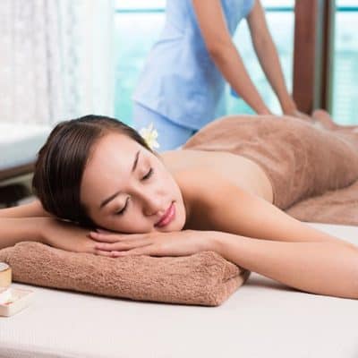 Woman having full body massage treatment. Learn how with ITEC Body Massage certificate