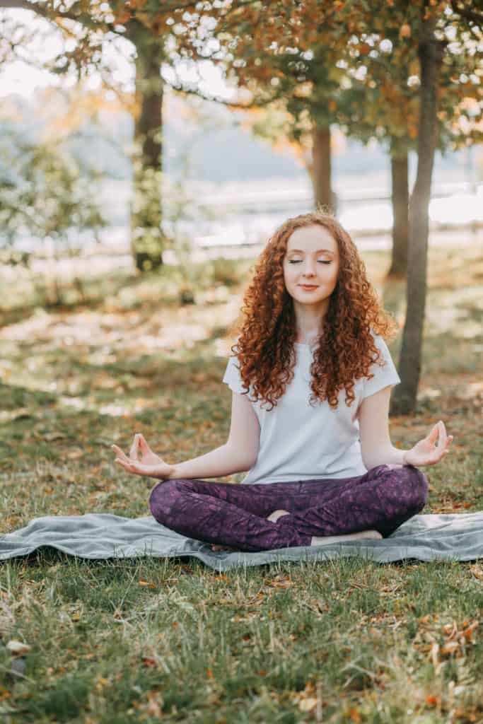 young lady doing morning meditation